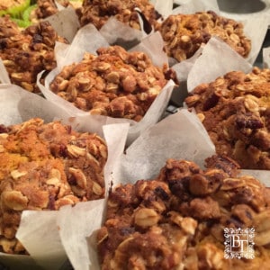 A tray of Pumpkin Pecan muffins showing the crumble topping.