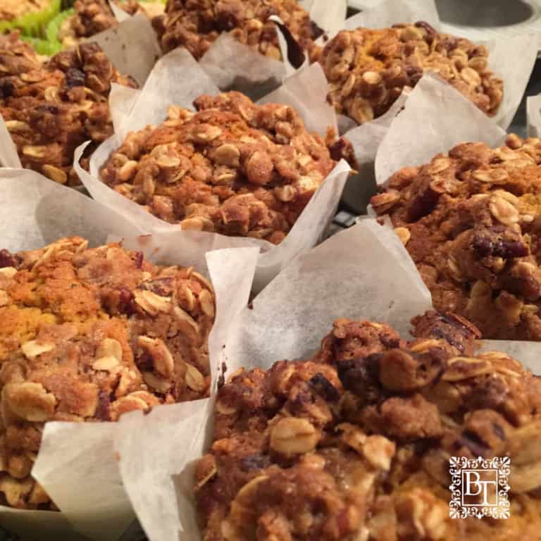 A tray of Pumpkin Pecan muffins showing the crumble topping.