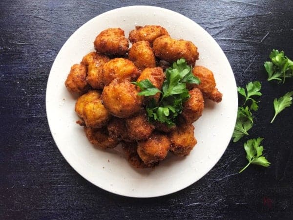 A plate of cheesy bacon poppers