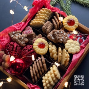 A wooden box filled with biscuits to gift for Christmas