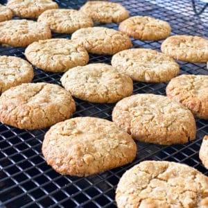 Close up of Anzac cookies on a cooling rack