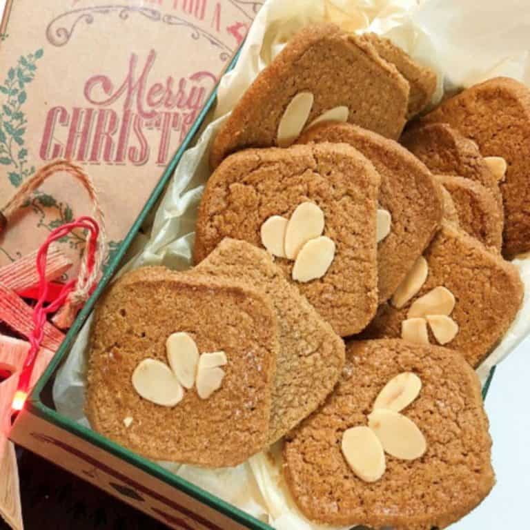 A box filled with homemade speculaas to give as a Christmas gift.