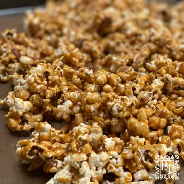 A baking tray covered with carmel and nut covered popcorn (aka Lolly gobble bliss bombs).